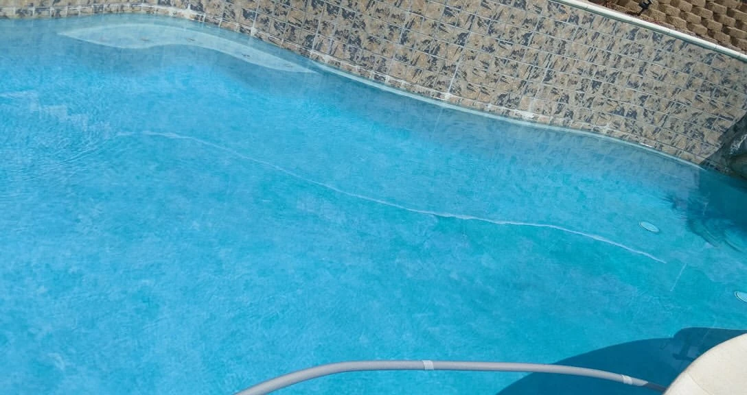 Pool tile and clear water after cleaning