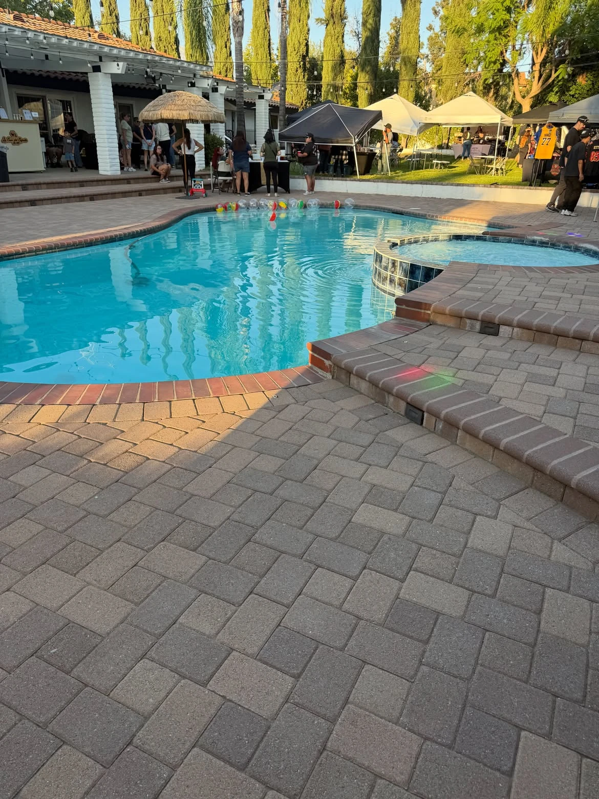 Pool and paver deck set up for a backyard party